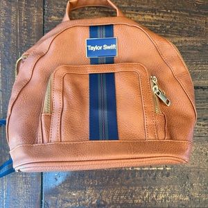 Taylor swift official website brown back pack